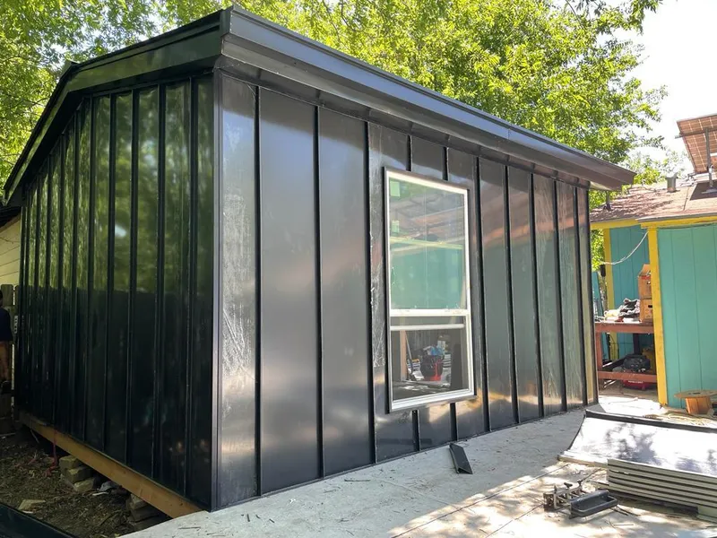 Black standing seam metal wall panels for Roof Inspection in Signal Hill